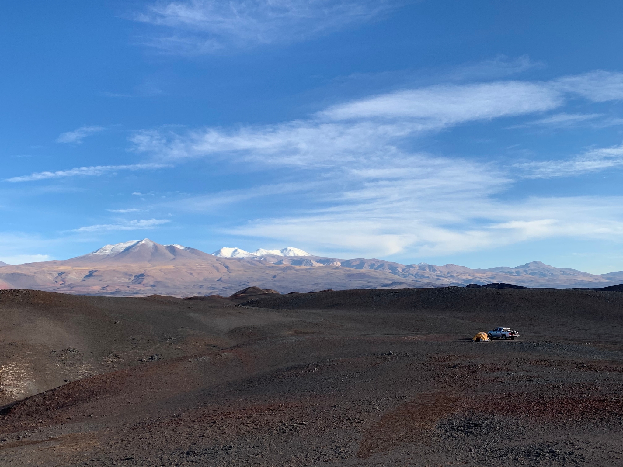 Camp on a flow of the Antofalla volcano (background)